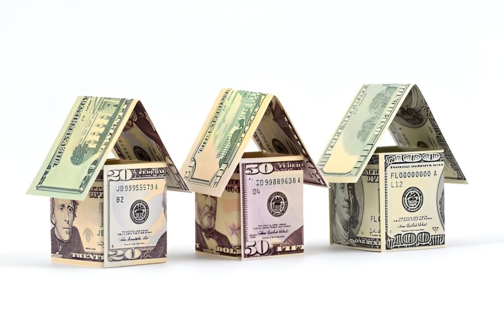 miniature houses made from dollar bills